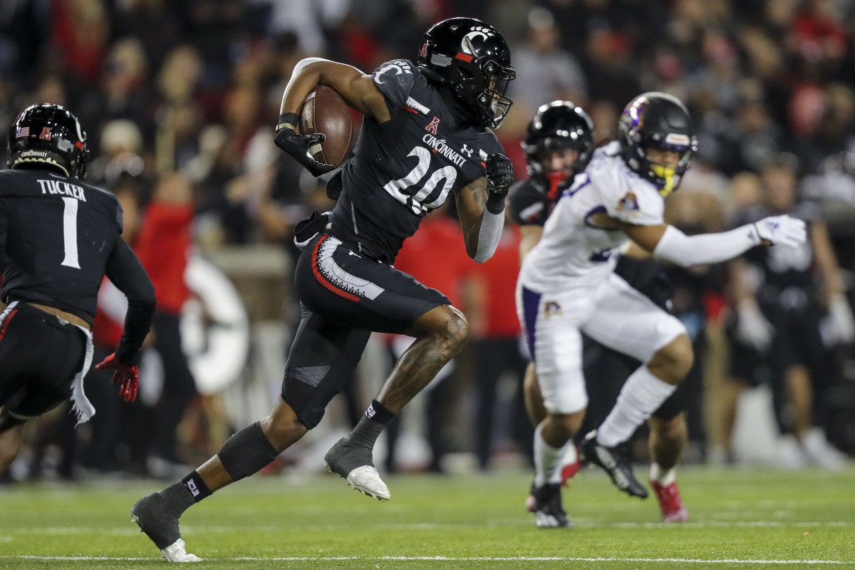 Nov 11, 2022; Cincinnati, Ohio, USA; Cincinnati Bearcats wide receiver Jadon Thompson (20) returns the kick off and runs it for a touchdown against the East Carolina Pirates in the first half at Nippert Stadium. Mandatory Credit: Katie Stratman-USA TODAY Sports